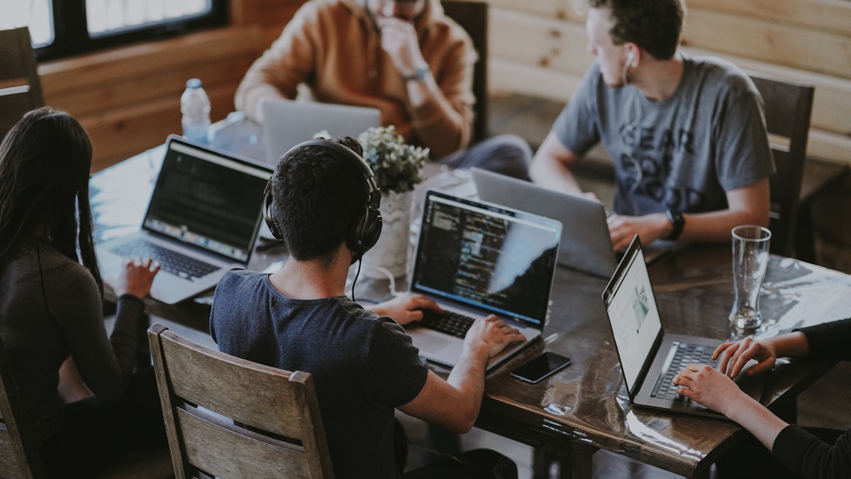 Tech startup team celebrating employee stock ownership plan grants