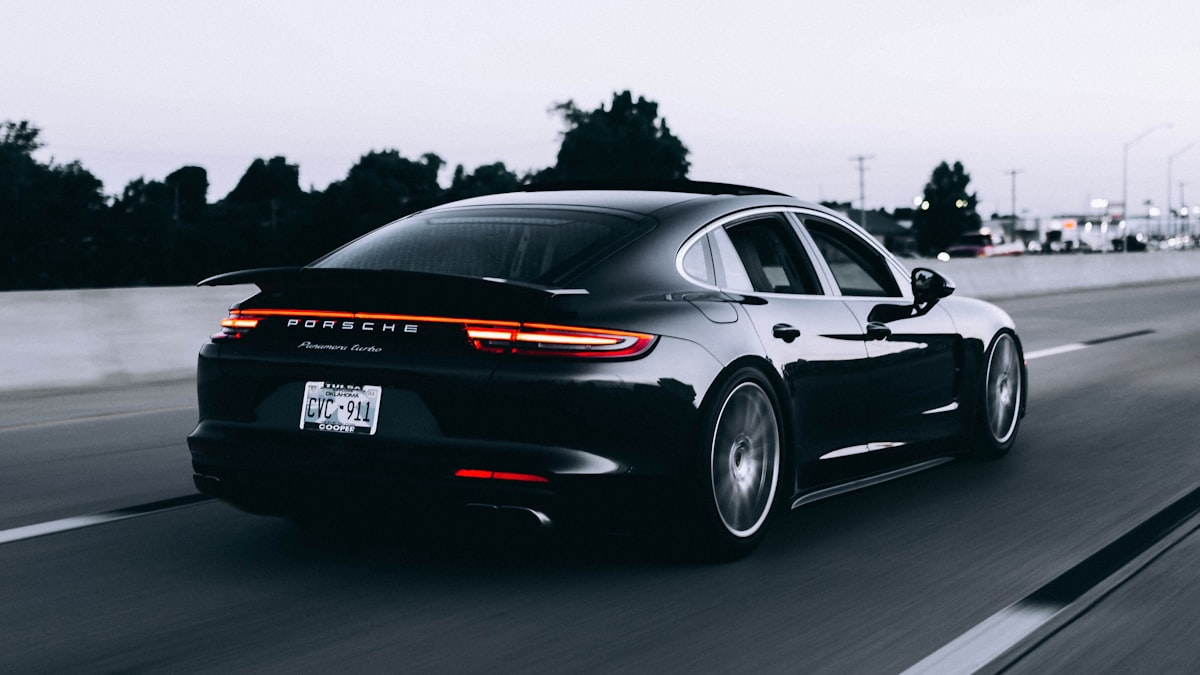 Luxury company vehicle on open road representing benefit-in-kind taxation