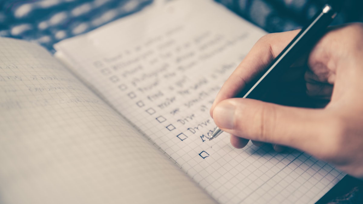 Comprehensive financial checklist, passport and coffee for Luxembourg expats