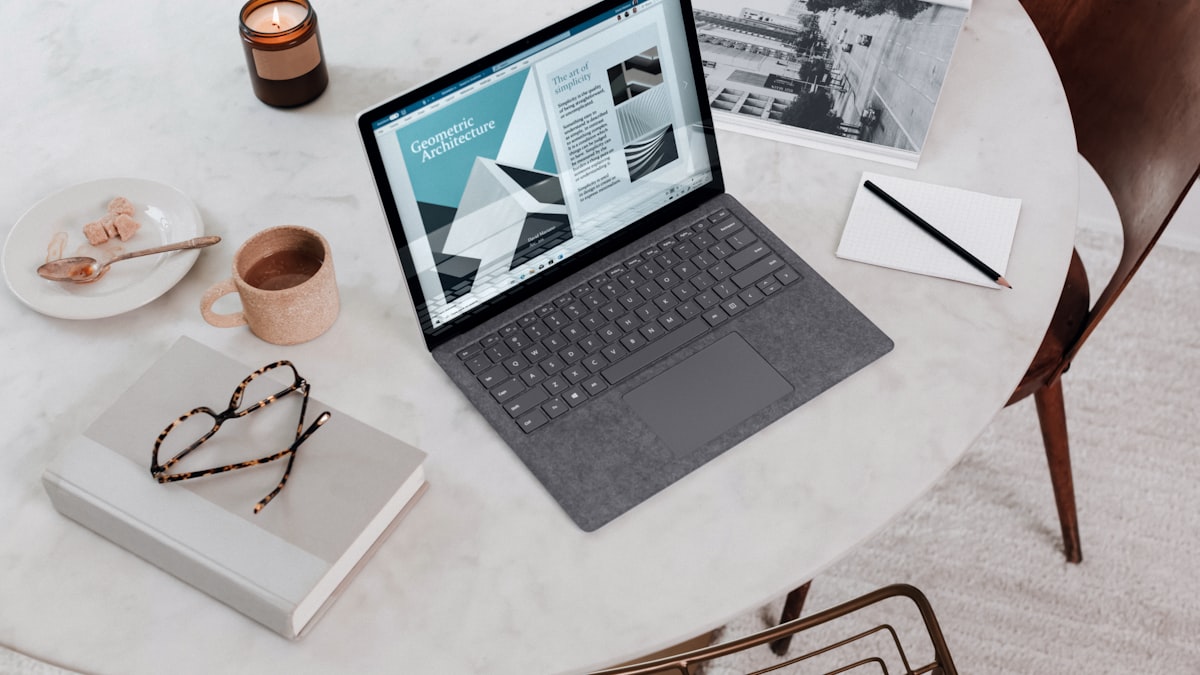 Home office desk with laptop and coffee for Luxembourg teleworking